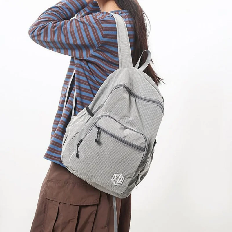 حقيبة ظهر مقاومة للماء وسريعة الجفاف وقابلة للطي للنساء - حقيبة نهارية للسفر خفيفة الوزن بلون الحلوى #1