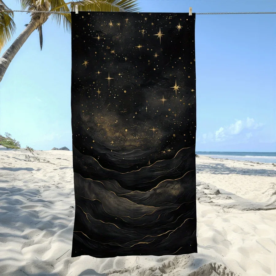 Black and gold starry sky and galaxy patterned beach towel, made of polyester, machine washable, perfect for travel and pool use