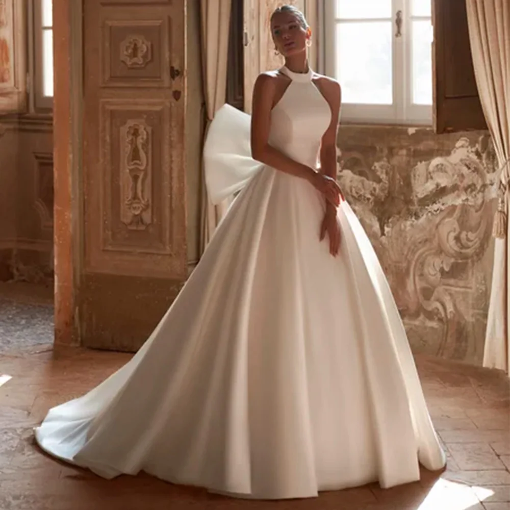 

Очаровательное свадебное платье без рукавов с лямкой на шее Vestido De Novia по индивидуальному заказу, свадебные платья трапециевидной формы с бантом, темпераментные атласные свадебные платья для женщин и невесты