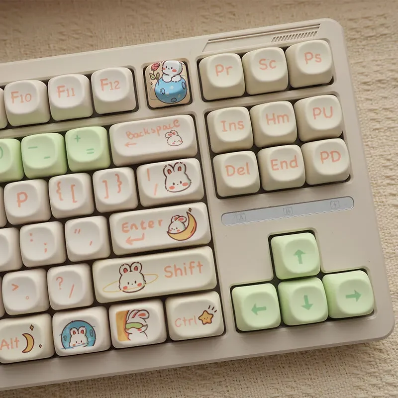 

Cute space rabbit themed keycaps in soft milk powder tone crafted with MOA profile for a whimsical