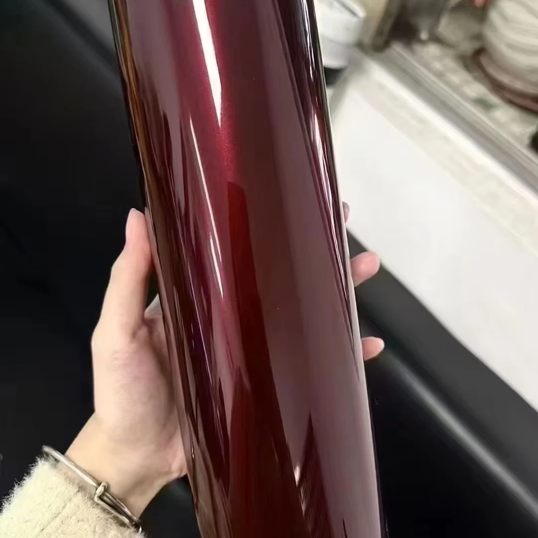 

Manufacturers high-quality vinyl car films - glossy magenta car wraps that are PVC-based and used for covering vehicle paint