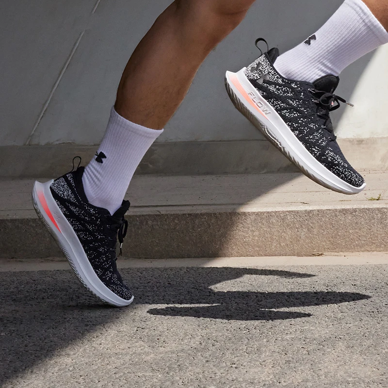 

Under Armour Women's FLOW Series Sports Shoes with Black Mesh, White Specks and Pink Accents