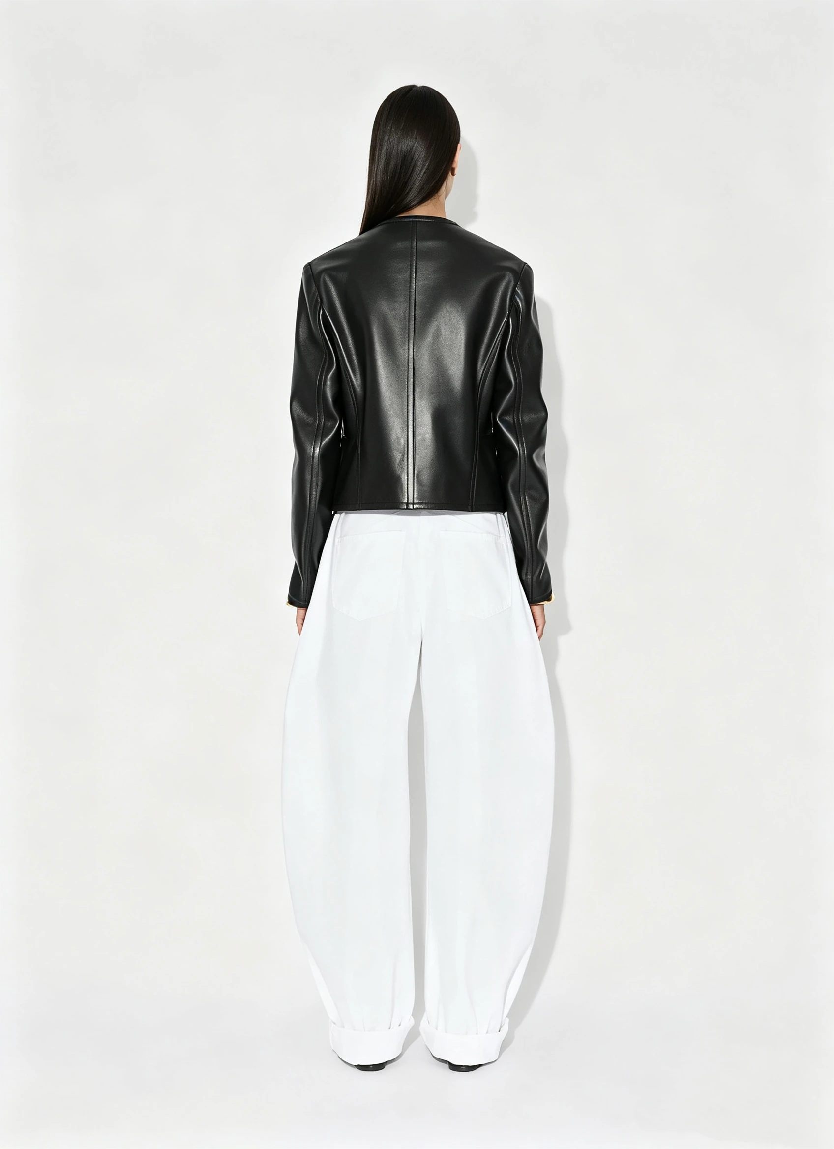 Minimalist Black Cropped Leather Jacket with Collarless Design and Curved Hem