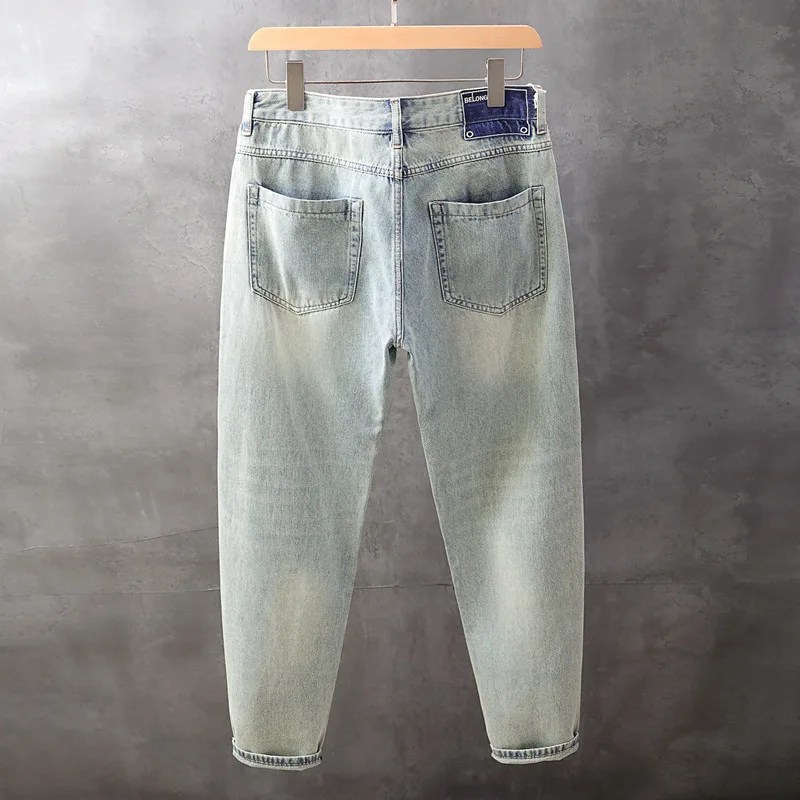 Celana denim pria musim gugur terbaru, warna terang, efek cuci, model sedikit meruncing, longgar, trendi, serbaguna, dan ramping.