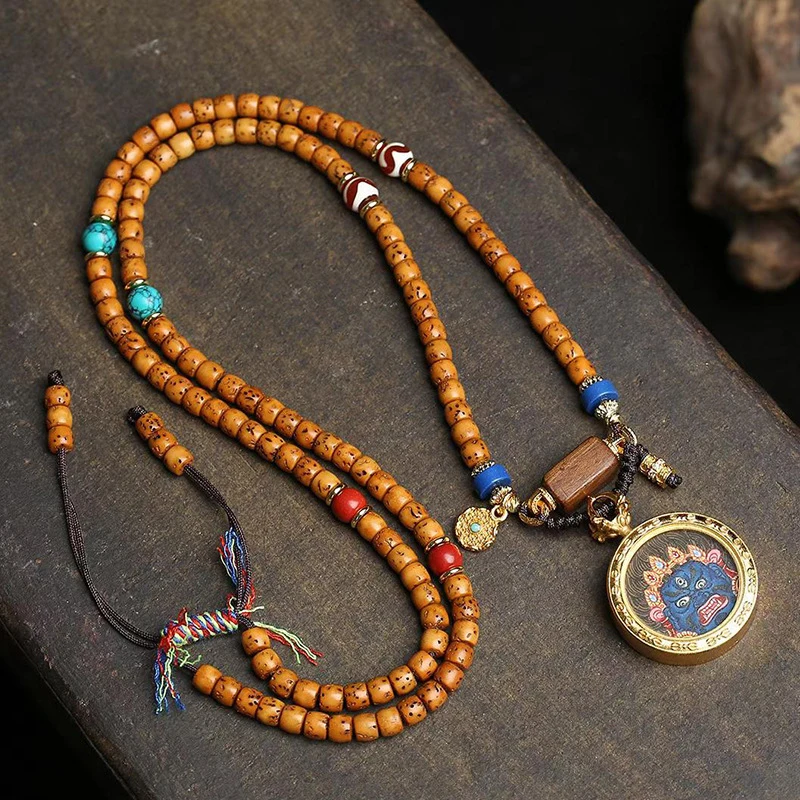 

Расписанный вручную буддийский браслет-танка из 108 бусин с многослойными костяными бусинами.