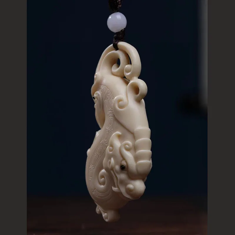 

Ivory Nut Carved Prosperity Brought by the Dragon and the Phoenix Pendant Hand Pieces Portable Dragon Pendant Crafts Pendant