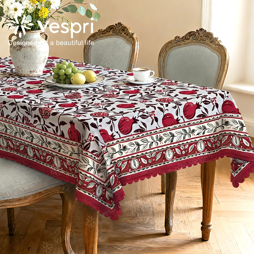 Vespri Spring Tablecloth, with white and red decorations, featuring pomegranates and green leaves, circular shape.