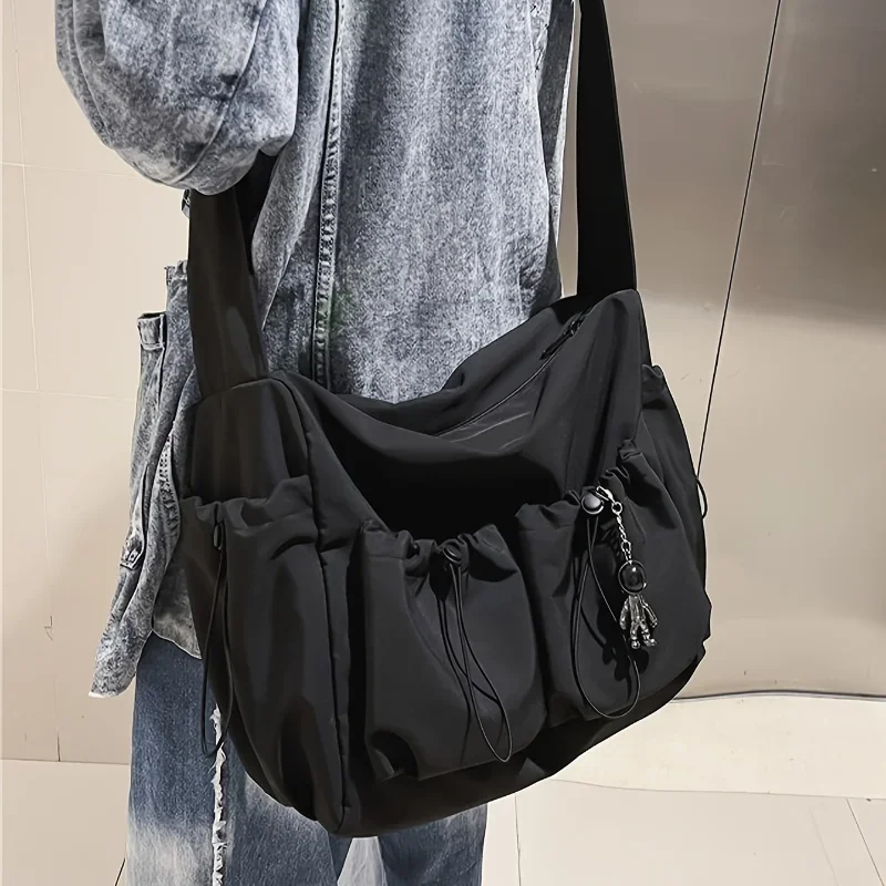 Fashionable Crossbody Bag with Drawstring Accent - Spacious & Secure Zipper Closure - Includes Stylish Bag Charm