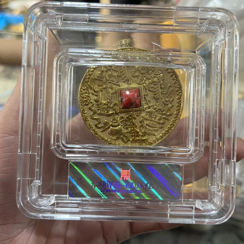 Gold-plated copper coin with square holes and embossed design, made by the Qing Dynasty in 1767 (25th year of the Qianlong era)