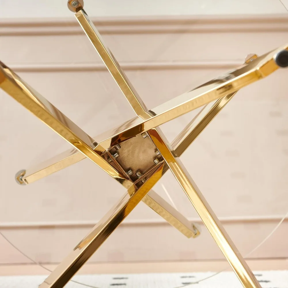 طاولة طعام حديثة من الزجاج الشفاف لـ 4 مقاعد بأرجل معدنية ذهبية، مثالية لمساحات المطبخ المعاصرة