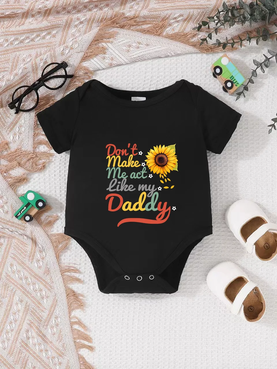 

Playful letter-printed baby short-sleeve triangle bodysuit. Button closure for easy dressing