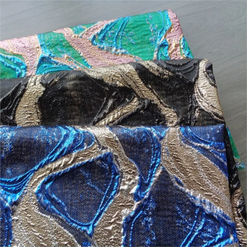 

A luxurious dress made of geometric woven gold jacquard fabric with bright silk and large crack pattern