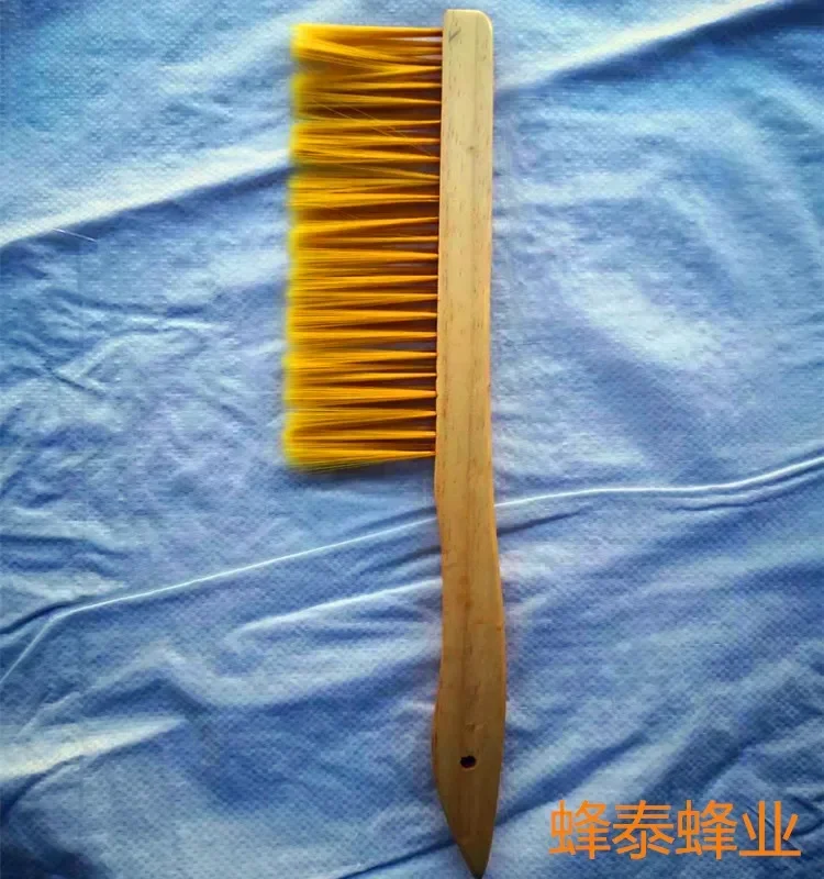 A Wooden Handle Bend To Sweep The Plastic Wire Bee