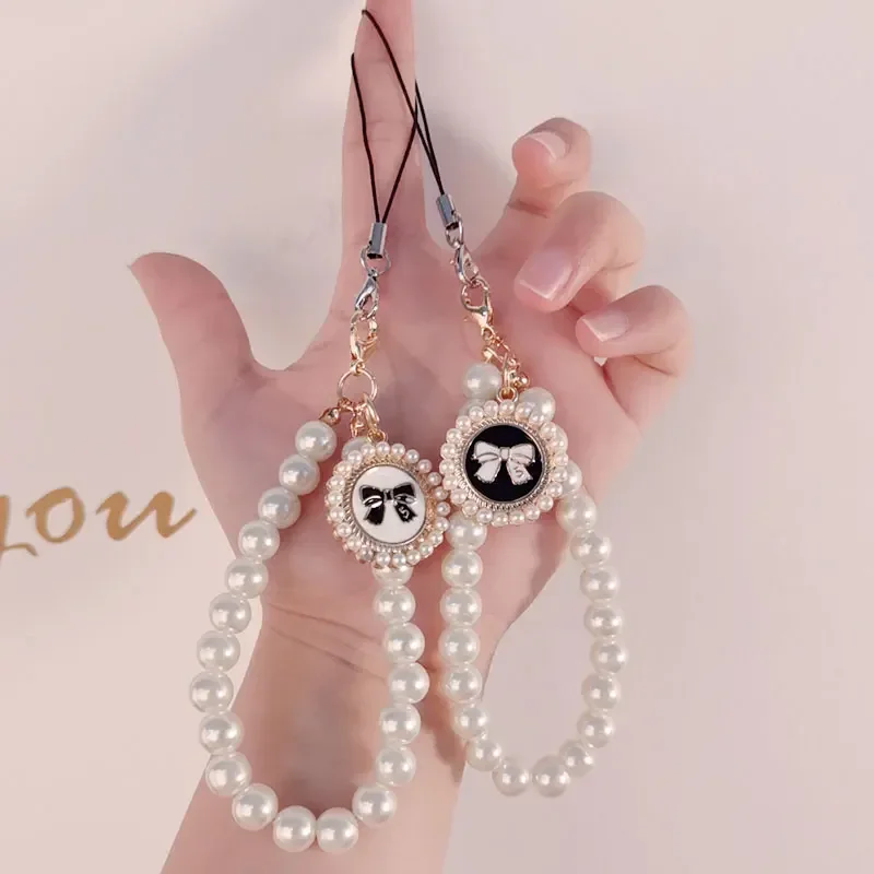 

Женский жемчужный бант, подвеска ручной работы, ремешок на запястье, блестящий зажим, защита от потери, подвеска для телефона