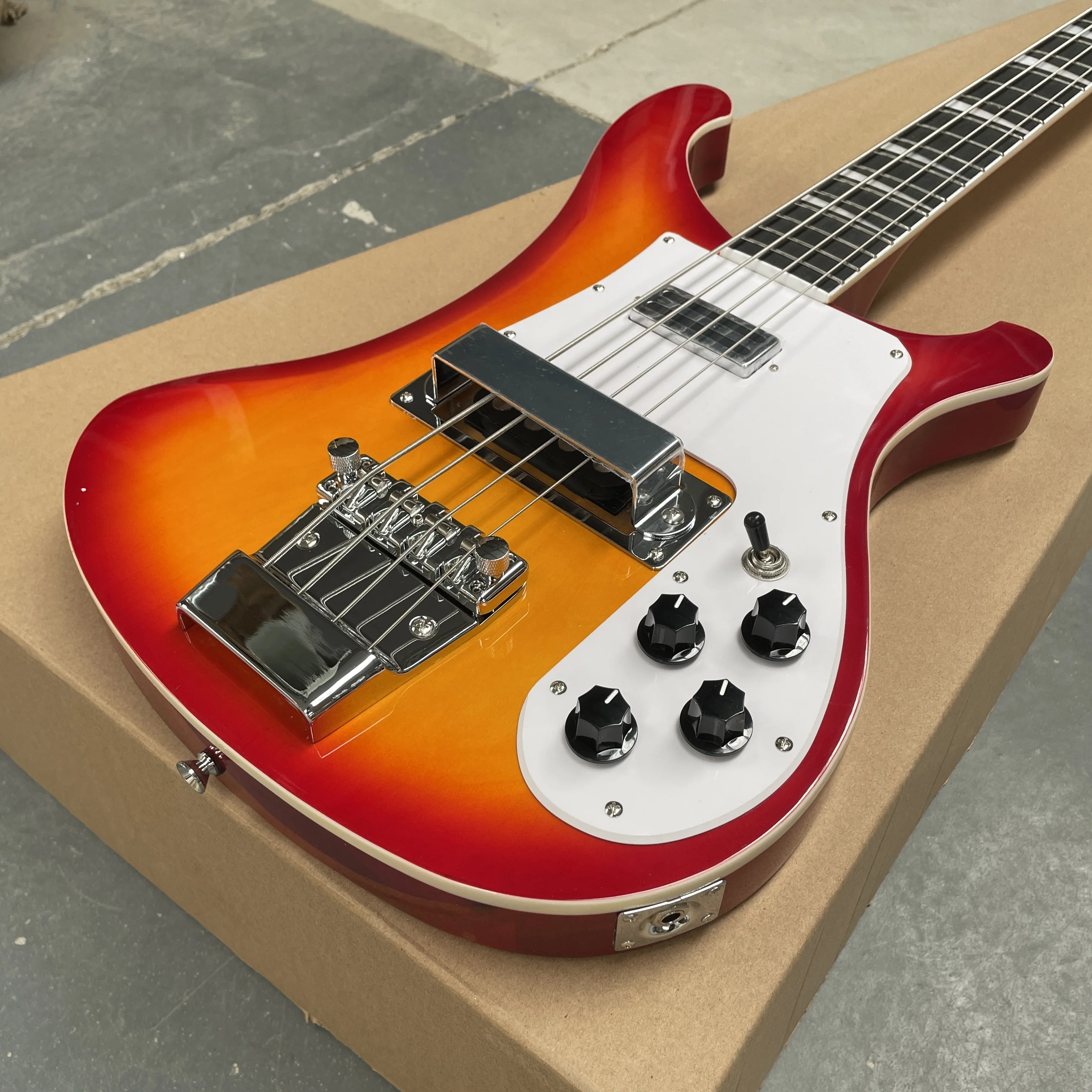 4-string vintage electric bass guitar, sunset gradient double pickup guitars, high appearance level rock bass electric guitarra
