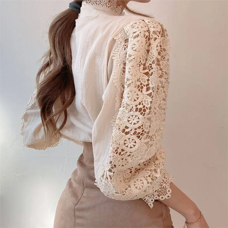 Blusa de encaje blanco para mujer, camisa Sexy de manga larga con botones de perlas, flores ahuecadas, malla transparente, Tops de primavera y verano