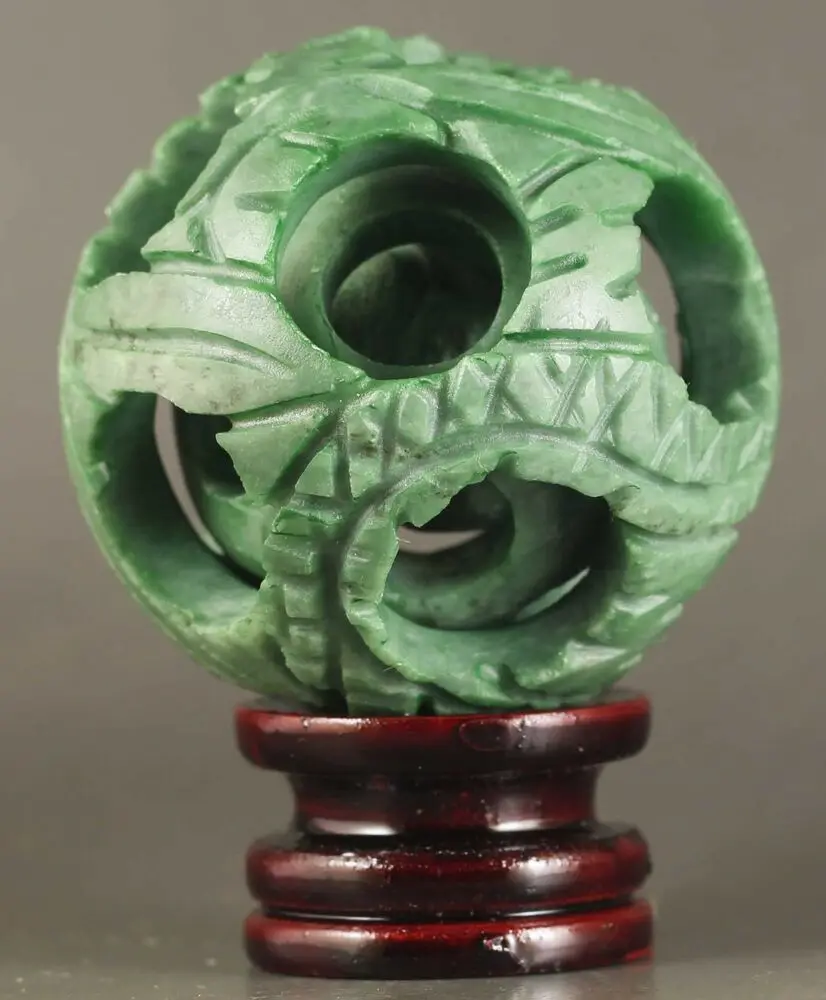 

Chinese Natural Jade Hand-Carved Jade Ball Hollowed Out Puzzling Ball Statue