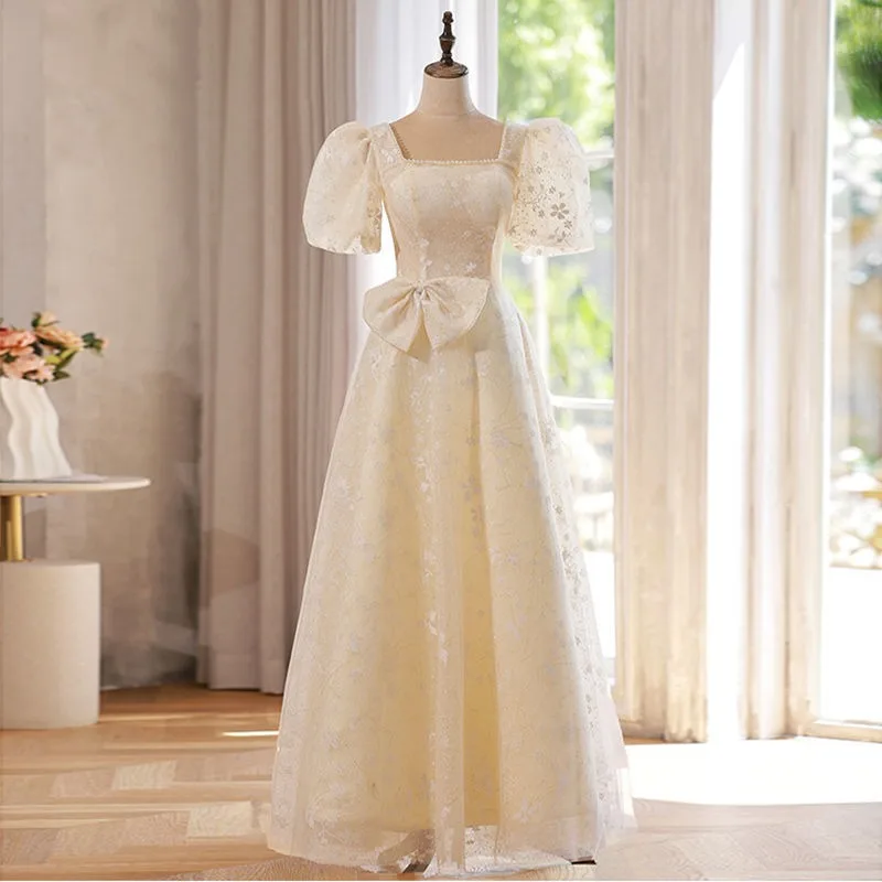 2026 New Women's Champagne Colored Bow Evening Dress Fashionable Slimming Pearl Decoration Square Neck Back Strap Mesh Dress