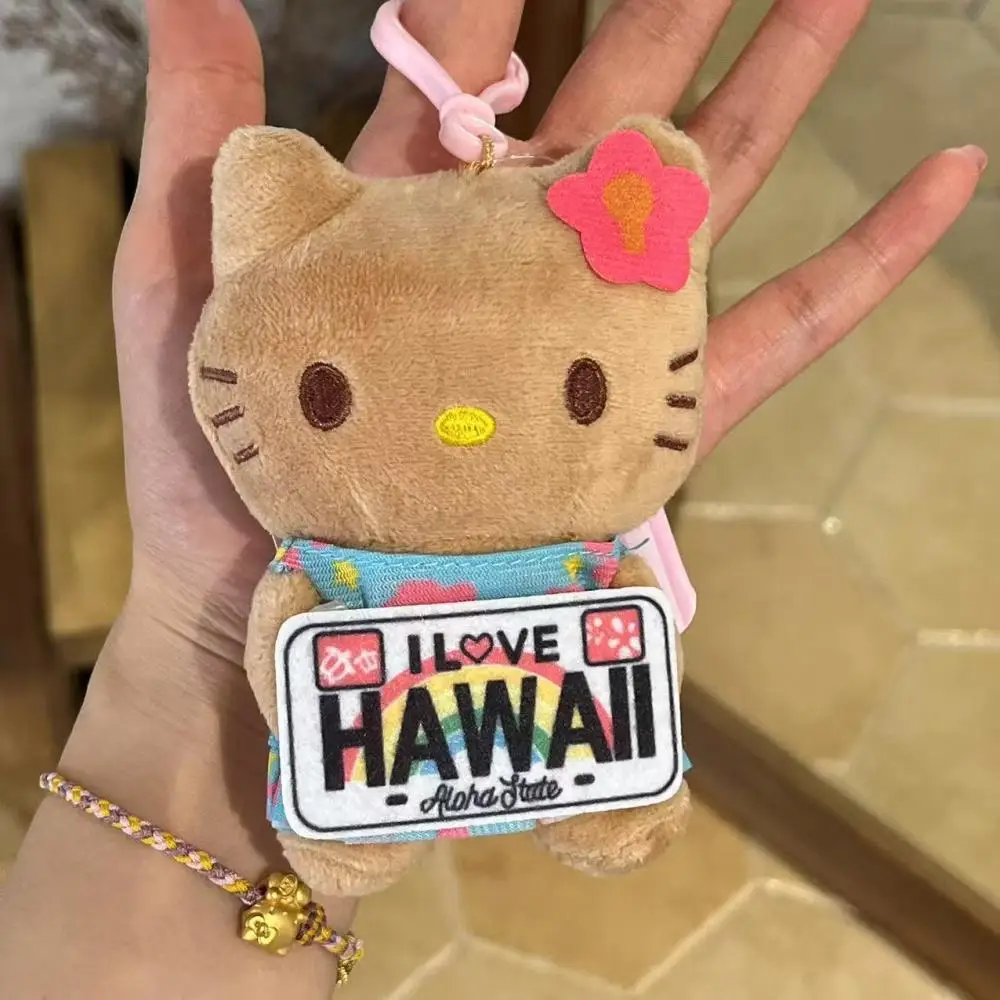 Sanrio peau noire soulève un signe Hello Kitty fille peluche poupée jouet sac à dos pendentif polyvalent décoration à la mode cadeau d'anniversaire