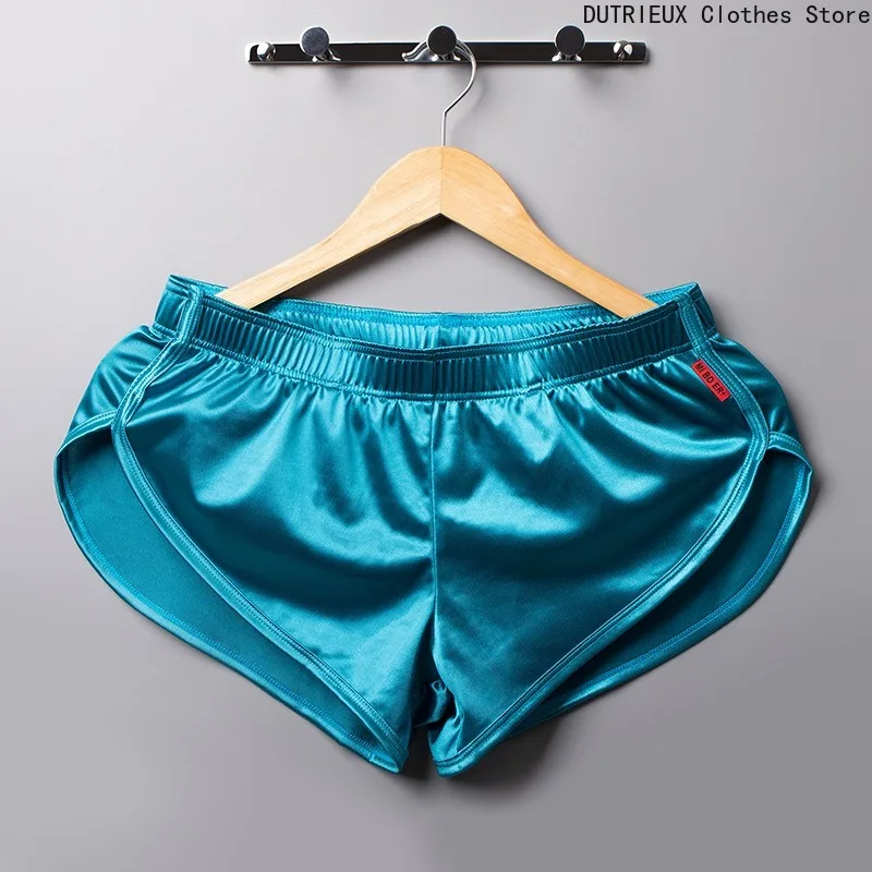 

Летние мужские шорты-боксеры. Гладкие повседневные дышащие быстросохнущие спортивные брюки с низкой талией. Универсальный выбор для пляжей и спортзалов.