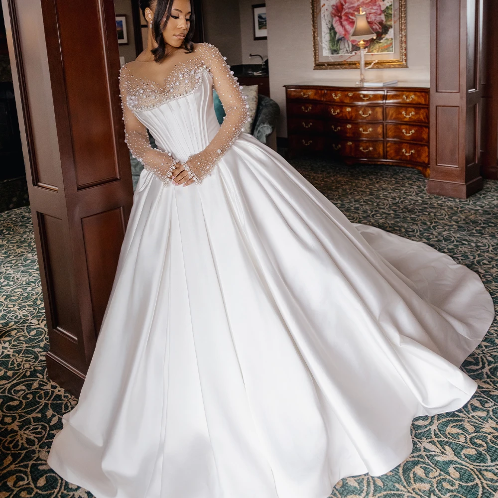 Luxury Satin Ball Gown Wedding Dresses for Bride O Neck Long Sleeve Sweep Train Pearls Crystal Nigeria Bridal Gown Customized
