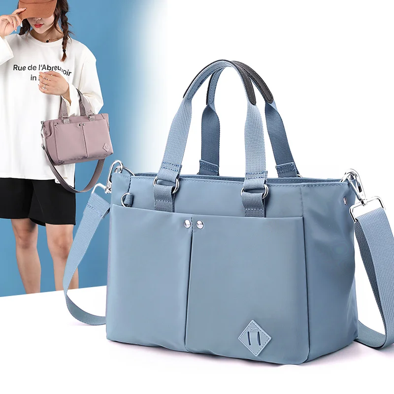 2023 clássico bolsa de ombro grande capacidade náilon bolsa à prova dwaterproof água casual alça superior bolsa de viagem feminina bolsa mãe