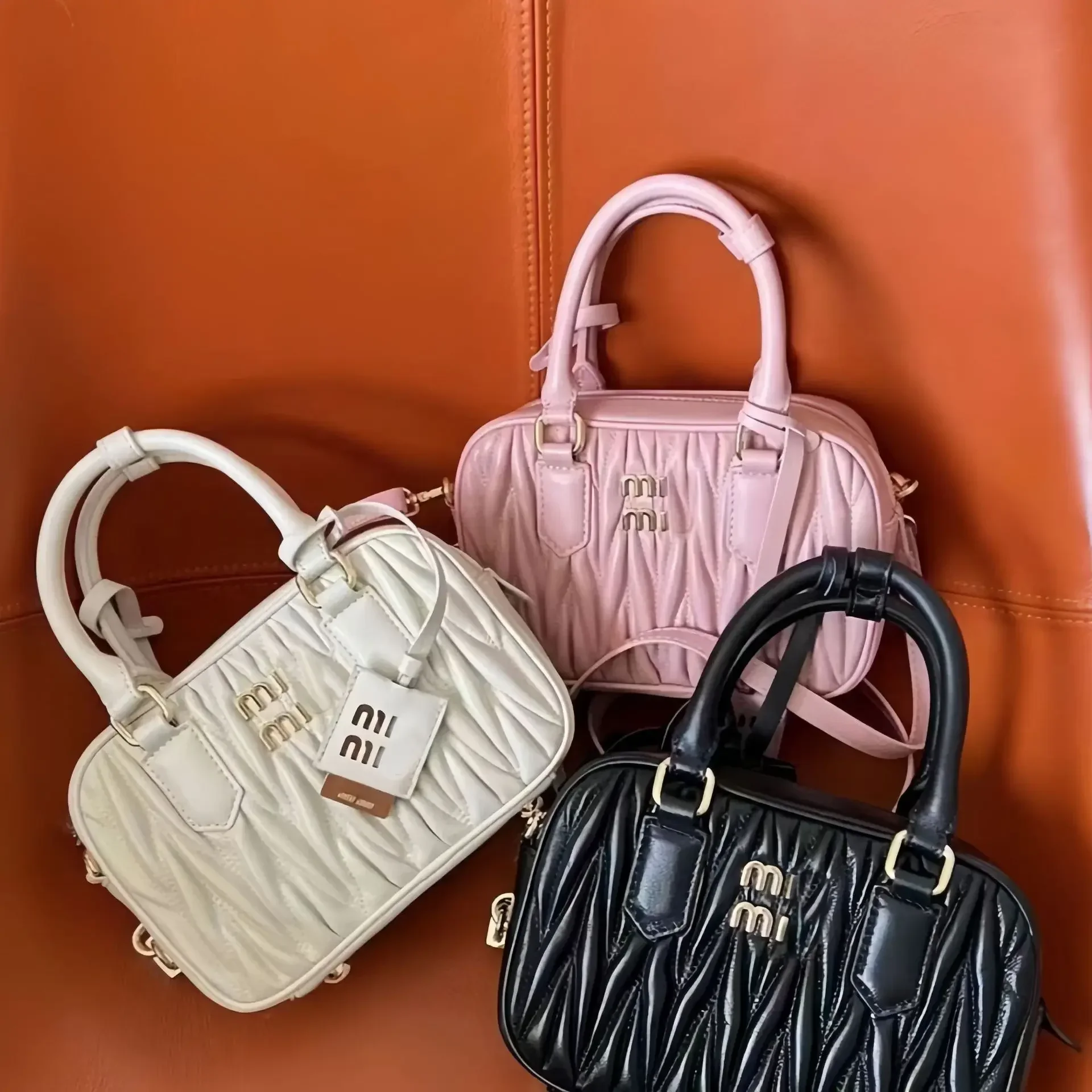 2024 New High Quality MIU Same Style Boston Bag Wrinkled Bowling Bag Fashion Single Shoulder Crossbody Handheld Women\'s Bag