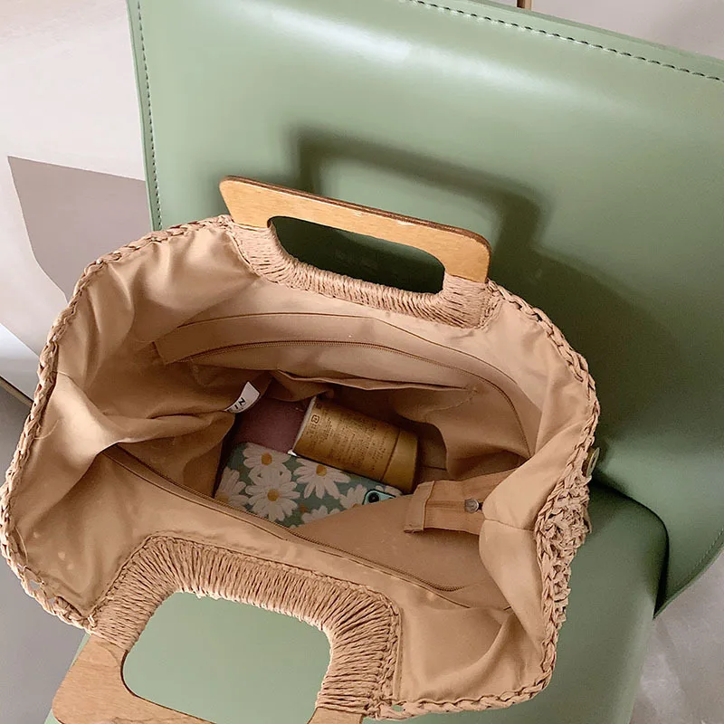 Borsa estiva in paglia intrecciata borsa con manico in legno femminile borsa da spiaggia da viaggio di grande capacità Totes stile moda scava fuori