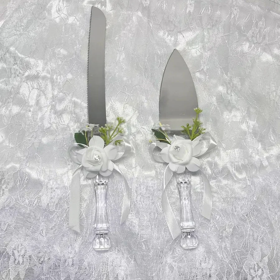 A box of wedding cutlery with rose decoration for cake cutting, bridal season and engagement supplies