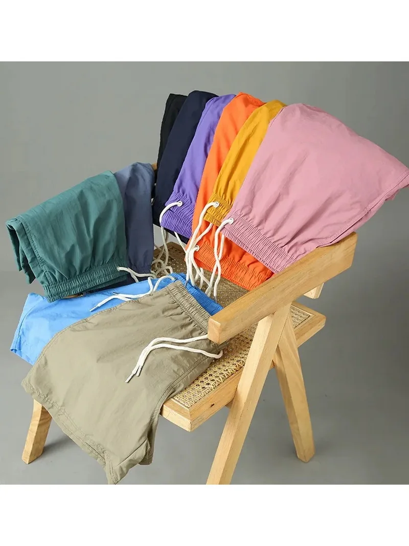 

Новые летние мужские спортивные повседневные быстросохнущие пляжные шорты свободного прямого кроя, однотонные, длиной до колена, дышащие