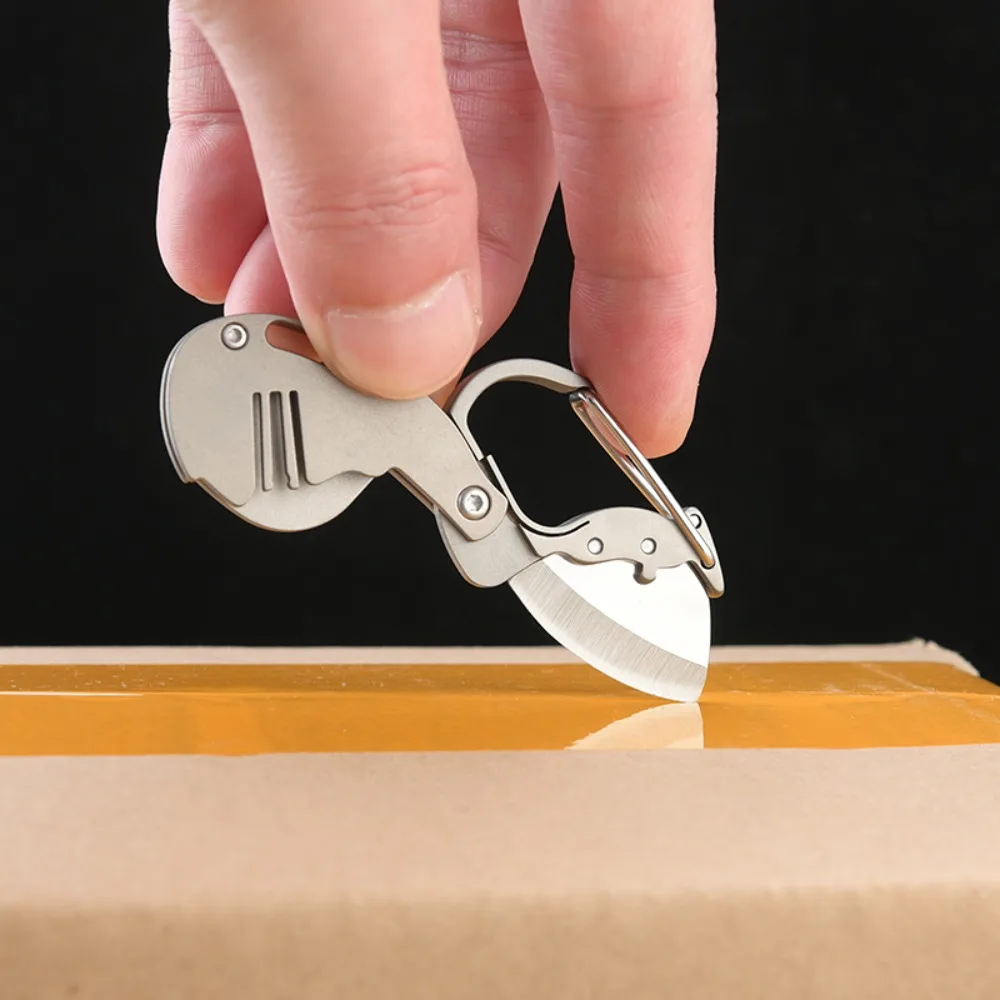 Cuchillo táctico plegable compacto de aleación de titanio - imagen 2