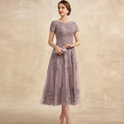 Abito corto vintage per la madre della sposa 2024 Scollo rotondo Lunghezza tè Applicazioni in pizzo Abito da cerimonia nuziale in tulle a trapezio