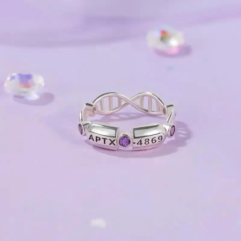 Detective Conan mismo estilo 4869 cápsula APTX tema nicho lindo anillo simple accesorios de anime regalos de vacaciones para hombres y mujeres