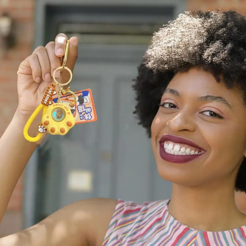 Llaveros de dibujos animados de PVC para mochilas, colgante de pata portátil y creativo con luz de puesta de sol para mochila, estuche de lápices móvil