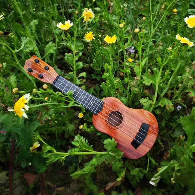 Grundschul-Musikgitarrenspielzeug für Kinder mit Paddeln, simuliertes Ukulele-4-Saiten-Instrument