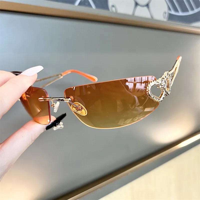 New Oval Cat Eye Frameless Mercury Sunglasses With Heart-Shaped Metal Hollow Out Y2K Sweet and Cool Hot Girl Sun Glasses - view 3