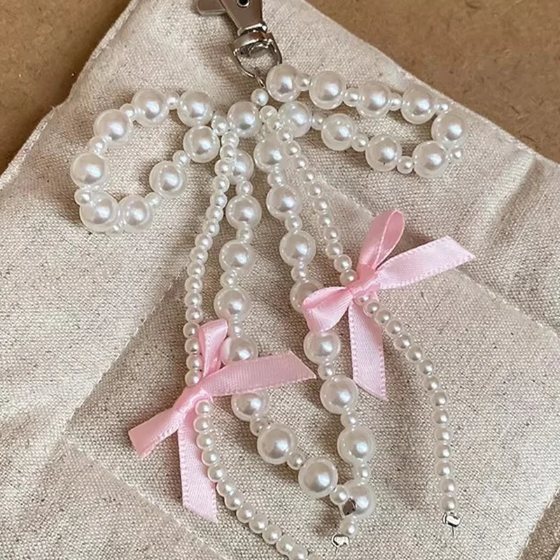 Y2K INS اللؤلؤ Bowknot المفاتيح النساء اللؤلؤ شرابات الوردي الشريط الحلو معلقة Keyrings ظهره حلقة رئيسية اليدوية مجوهرات هدايا