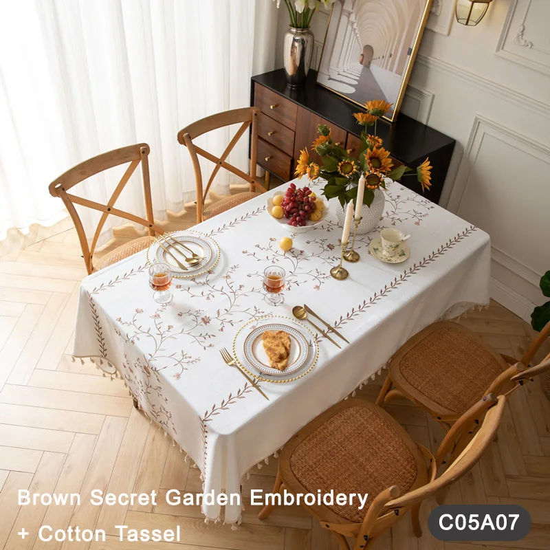 

Bright and Fresh Embroidered Tablecloth with Checkered Floral Pattern and Tassels for a Chic Ambiance