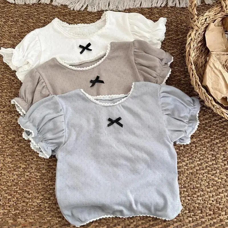 

2026 Summer New Girls Cute Bow Short Sleeve T Shirts Solid Baby Girl Lace Collar Tops Cotton Infant T Shirts Toddler Clothes
