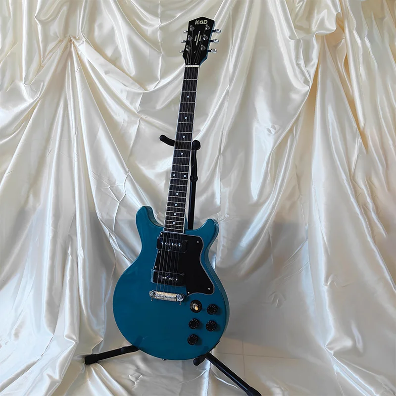 Stunning lake-blue electric guitar, dual P90 pickups, rocks both blues and rock, 22 frets, 6 strings, totally rock