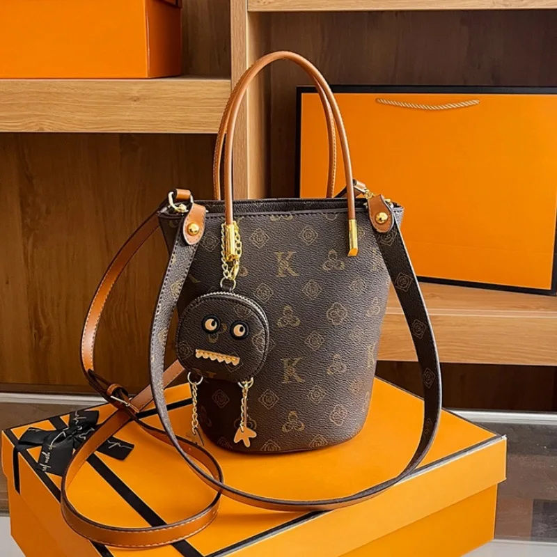 New High-end Printed Hand-held Bucket Bag with Pendant for Women Light Luxury Classic Single Shoulder Crossbody Bag Daily Use