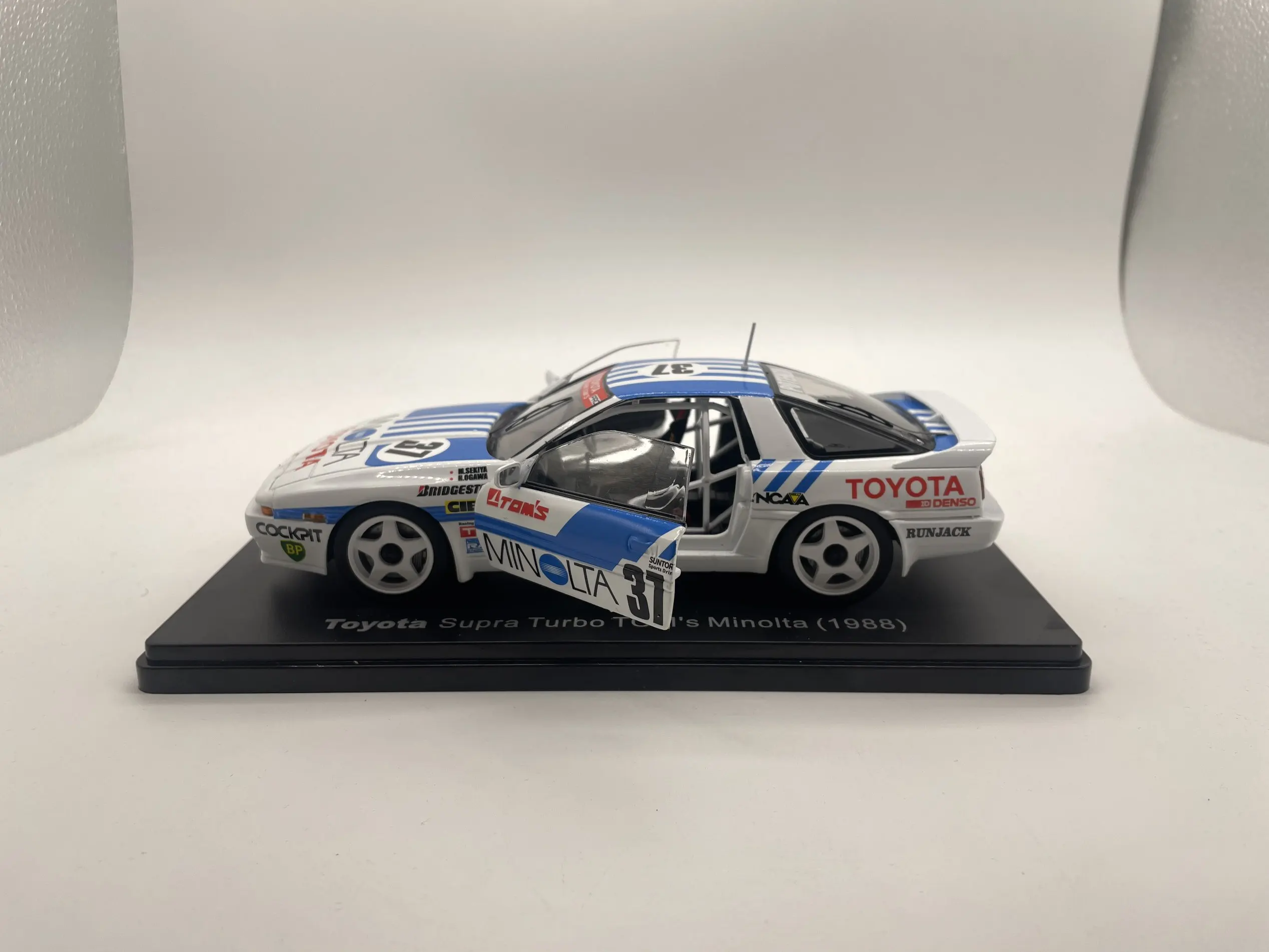 

1/24 Die-Cast Model Car Supra Turbo TOM'S Minolta 1988 2 Door Open Children's Birthday Gift Toy Scene Matching With Home Decor