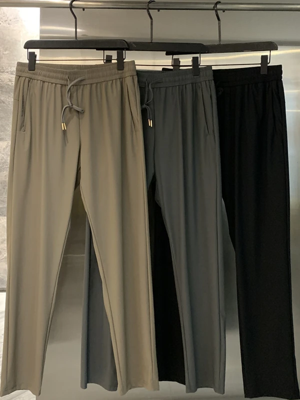 

Спортивные повседневные брюки из ледяного шелка, мужские эластичные брюки с эластичной резинкой на талии, эластичные летние новые модные прямые брюки