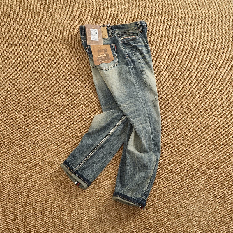 بنطلون جينز رجالي ثقيل الوزن بأرجل مستقيمة باللون الأبيض من قماش الدنيم المطاطي بنطلون طويل جينز صيفي عصري غير رسمي