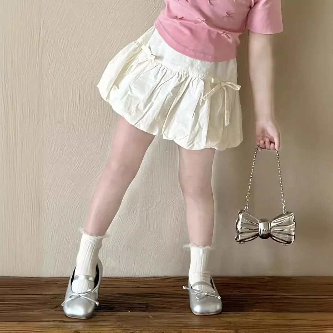 

Детская юбка для девочек, новинка лета 2025 года, юбка с бантом и цветком для девочек, детская короткая юбка в корейском стиле для маленьких девочек, модные короткие юбки для маленьких девочек