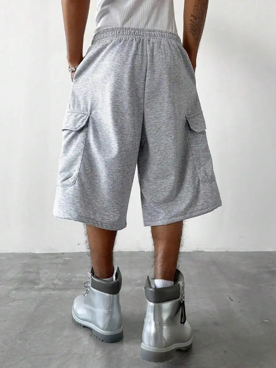

Grey Mens Loose-Fit Pleated Knee-Length Shorts Featuring Oversized Pockets For Summer Casual Wear And Travel