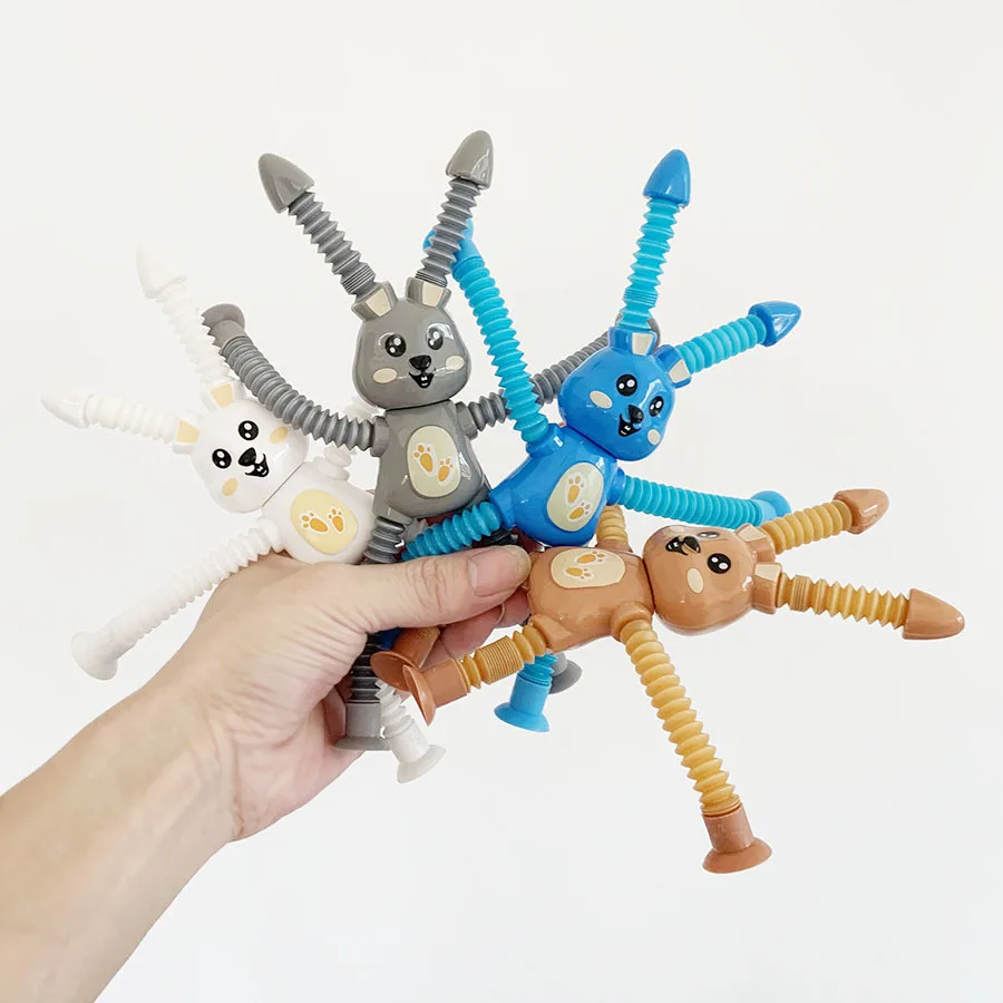 吸盤付きのマルチカラーの小さなウサギのおもちゃとチューブ引きのおもちゃはストレス解消に最適です。 装飾品として使用できます。