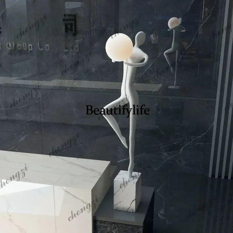 Modern welcoming abstract figure holding a lamp, sculpture ornament, creative floor lamp for living room and bedroom