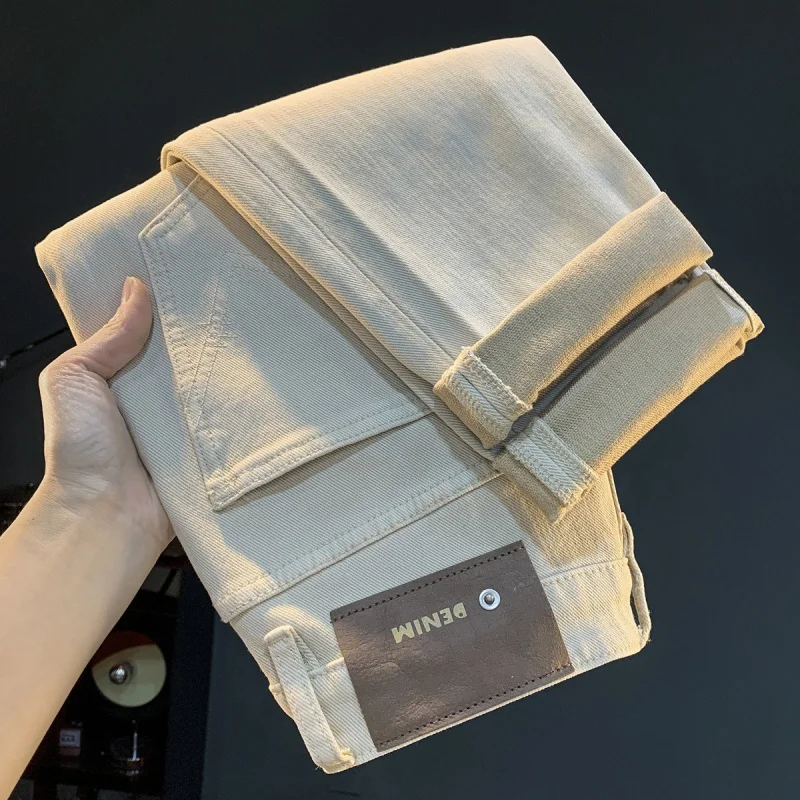 جينز فضفاض مستقيم الساق من رايس المشمش، مقاس كبير كاجوال وبسيط، موضة خريف 2025 سراويل متعددة الاستخدامات للرجال