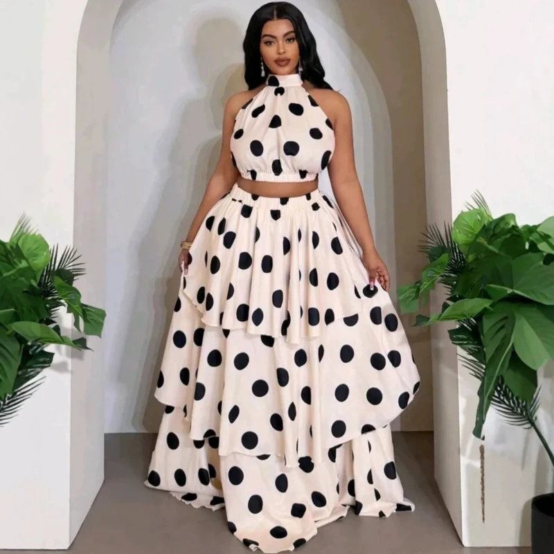 Neues modisches Sommerkleid-Set für Damen: Polka-Dot-ärmelloses Crop-Top und langer Rüschenrock im Cake-Stil.